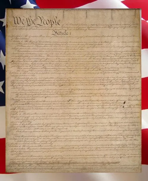 The United States Constitution against an American flag